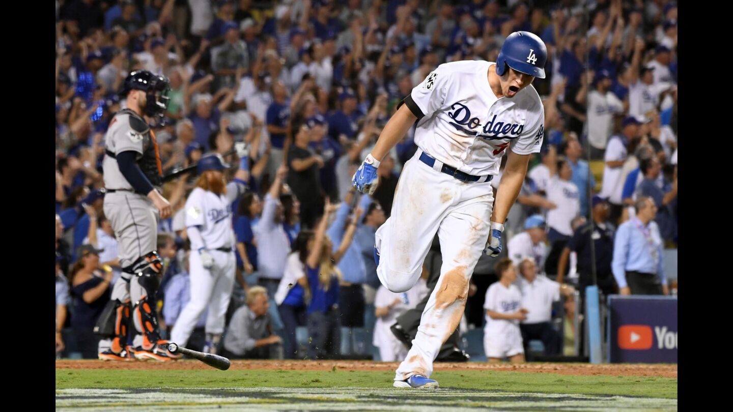 Corey Seager reacts after hitting a two-run home run during the sixth inning against Astros pitcher Justin Verlander.