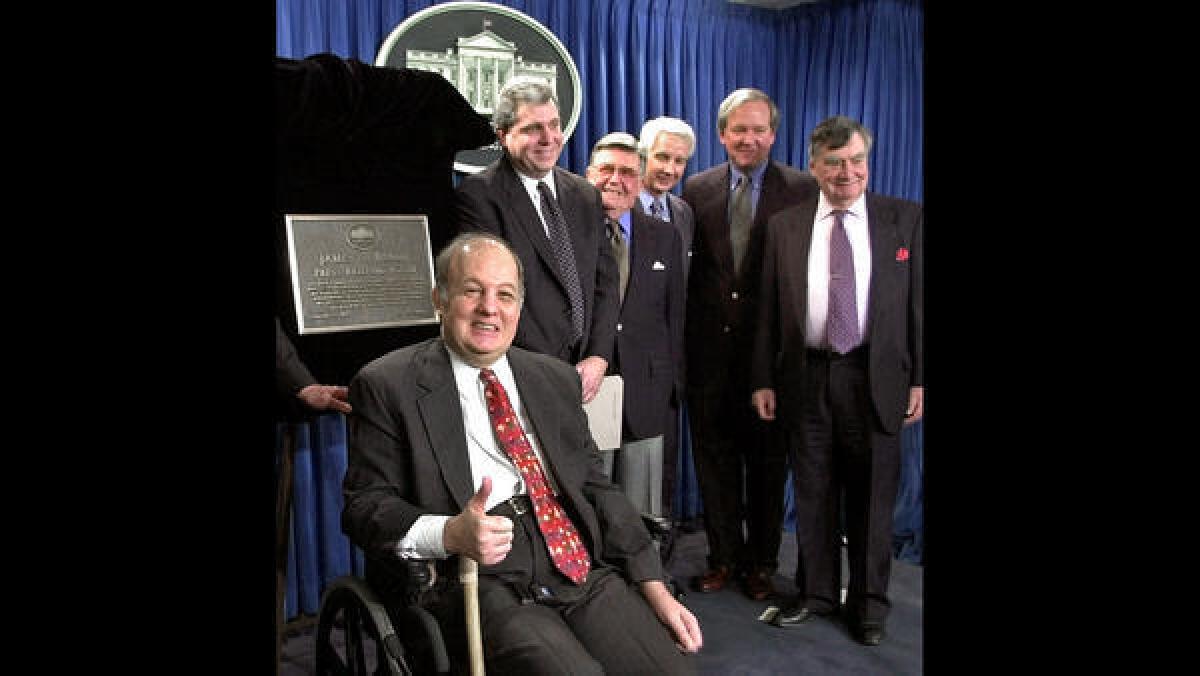 James Brady, press secretary to President Reagan, was left partly paralyzed by the gunfire that also wounded Reagan in 1981. ( Susan Walsh / Associated Press)