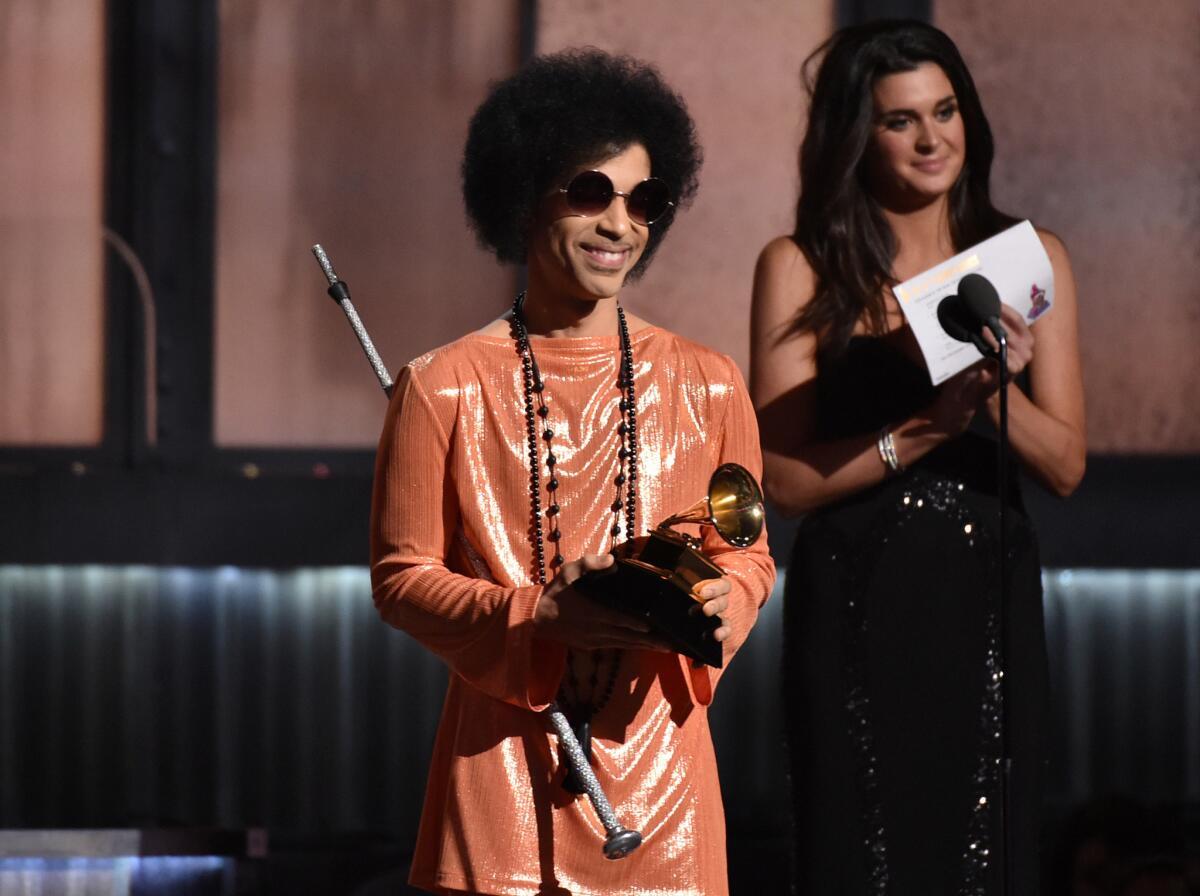 Prince presenting the album of the year Grammy in 2015. The Recording Academy ignored his early work, but gave him multiple trophies for his 1984 blockbuster album “Purple Rain” — although none were in the Grammy marquee categories of album, record or song of the year.