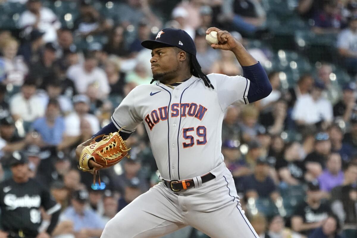Houston Astros starting pitcher Framber Valdez delivers during the first inning of a baseball game against the Chicago White Sox Wednesday, Aug. 17, 2022, in Chicago. (AP Photo/Charles Rex Arbogast)