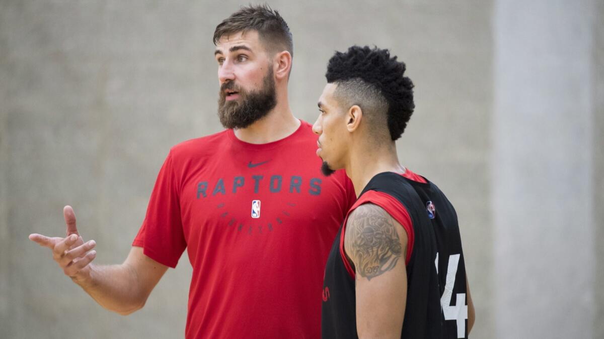 Center Jonas Valanciunas, left, and guard Danny Green give the Raptors flexibility with their starting lineup.