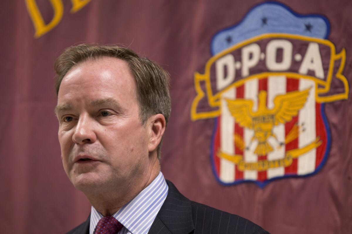 Michigan Atty. Gen. Bill Schuette announces criminal charges against two state regulators and a Flint employee in connection with the city's water crisis.
