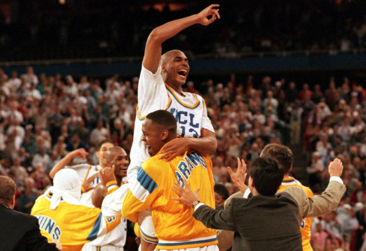 Ed O'Bannon is lifted into the air by UCLA teammate Ike Nwankwo after the Bruins' win over Arkansas in the 1995 NCAA title game.