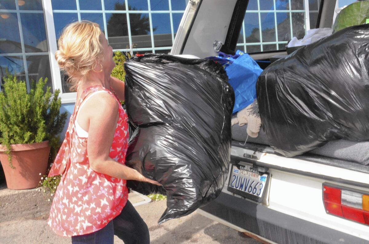 Real estate broker Sarah Butler makes laundry runs to nearby Mill Valley for some vacation renters, who swell Stinson Beach's population in the summer.