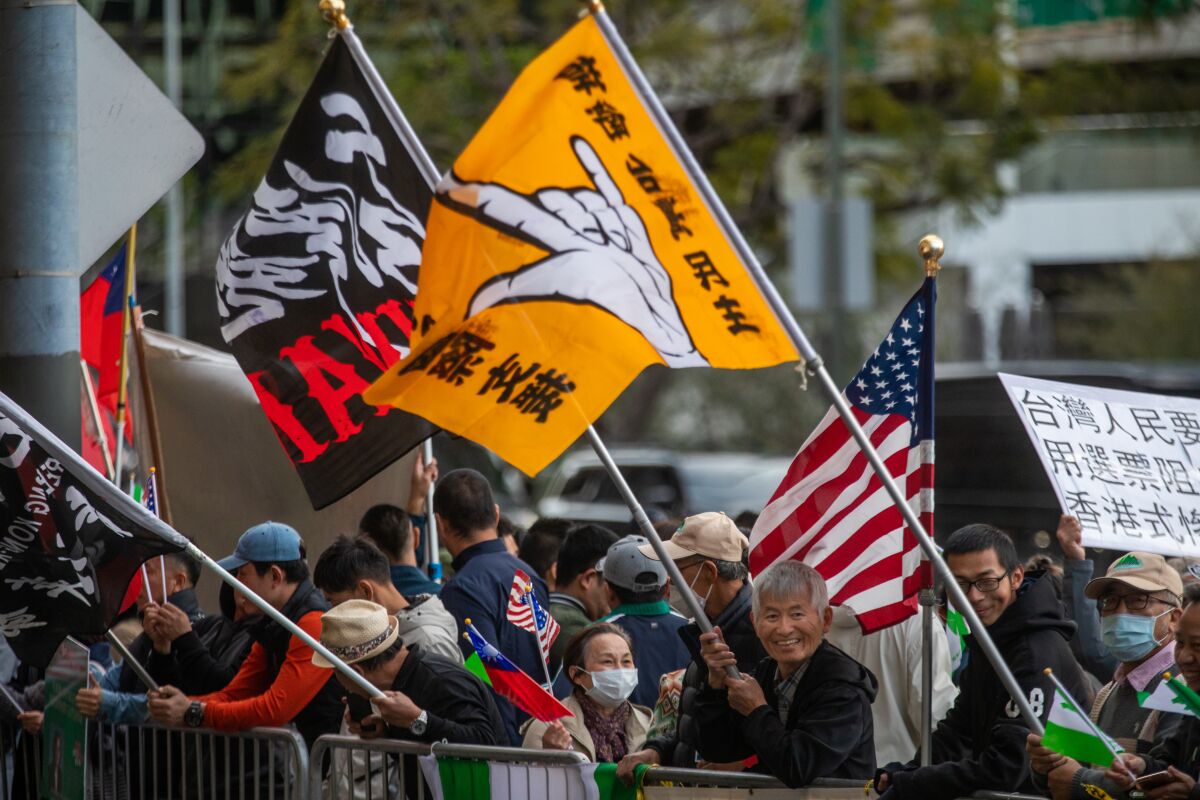 Taiwan supporters wave flags.