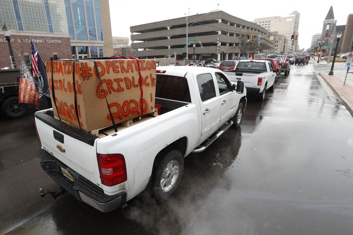 Vehicles line the streets of Lansing, the state capital of Michigan, on Wednesday to protest social distancing restrictions.