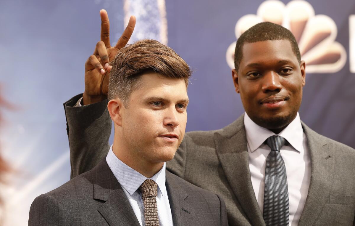 70th Emmy Awards show hosts Colin Jost, left, and Michael Che talk to media Thursday in Los Angeles ahead of Monday's Emmy ceremony.