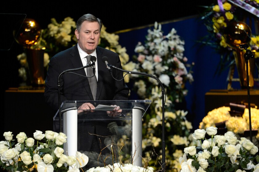Tim Leiweke, shown speaking at the memorial service for Lakers owner Jerry Buss, will be leaving AEG.