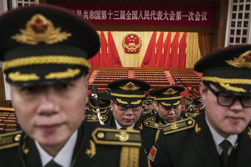 BEIJING, CHINA - MARCH 20: Members of a band from the People's Liberation Army leave following a speech by China's President Xi Jinping after the closing session of the National People's Congress at The Great Hall Of The People on March 20, 2018 in Beijing, China. The annual gathering of Chinese lawmakers concluded with a nationalistic speech by president Xi Jinping, his first public address since the abolishment of term limits marked the beginning of his indefinite rule. Xi spoke confidently of China's determination to take its place in the world, and gave the strongest sign in decades that the Communist government wants to bring Taiwan back under Beijing's control. Xi warned that China would never allow 'one inch' of territory to be separated from it, and said any attempts to split China will receive 'the punishment of history'. The denunciation appeared to be aimed at the United States, after U.S. President Donald Trump signed the Taiwan Travel Act this week that allows high-level U.S. visits to Taiwan. Xi's speech earned wide applause from the nearly 3,000 loyal delegates at the National People's Congress, which voted earlier this month to amend the constitution to allow the 64-year old Xi the possibility of being a 'leader for life'. The concentration of virtually unchecked power has stirred worries of China's return to an era of autocratic rule not seen since Mao Zedong. (Photo by Kevin Frayer/Getty Images)