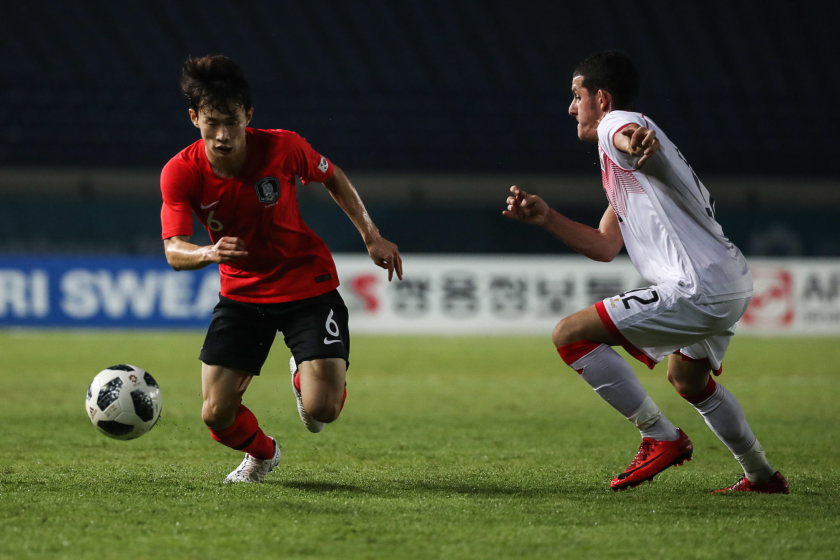 SOREANG, INDONESIA - AUGUST 15: Kim Moonhwan of South Korea and Jasim Alsalama of Bahrain.