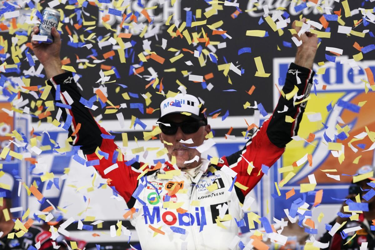 Kevin Harvick celebrates after winning a NASCAR Cup Series auto race at Richmond Raceway, Sunday, Aug. 14, 2022, in Richmond, Va. (AP Photo/Steve Helber)