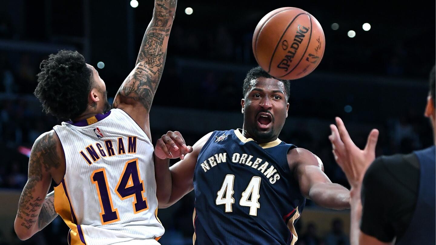 New Orleans Pelicans' Solomon Hill (44) gets a pass off in front of Lakers' Brandom Ingram (14).