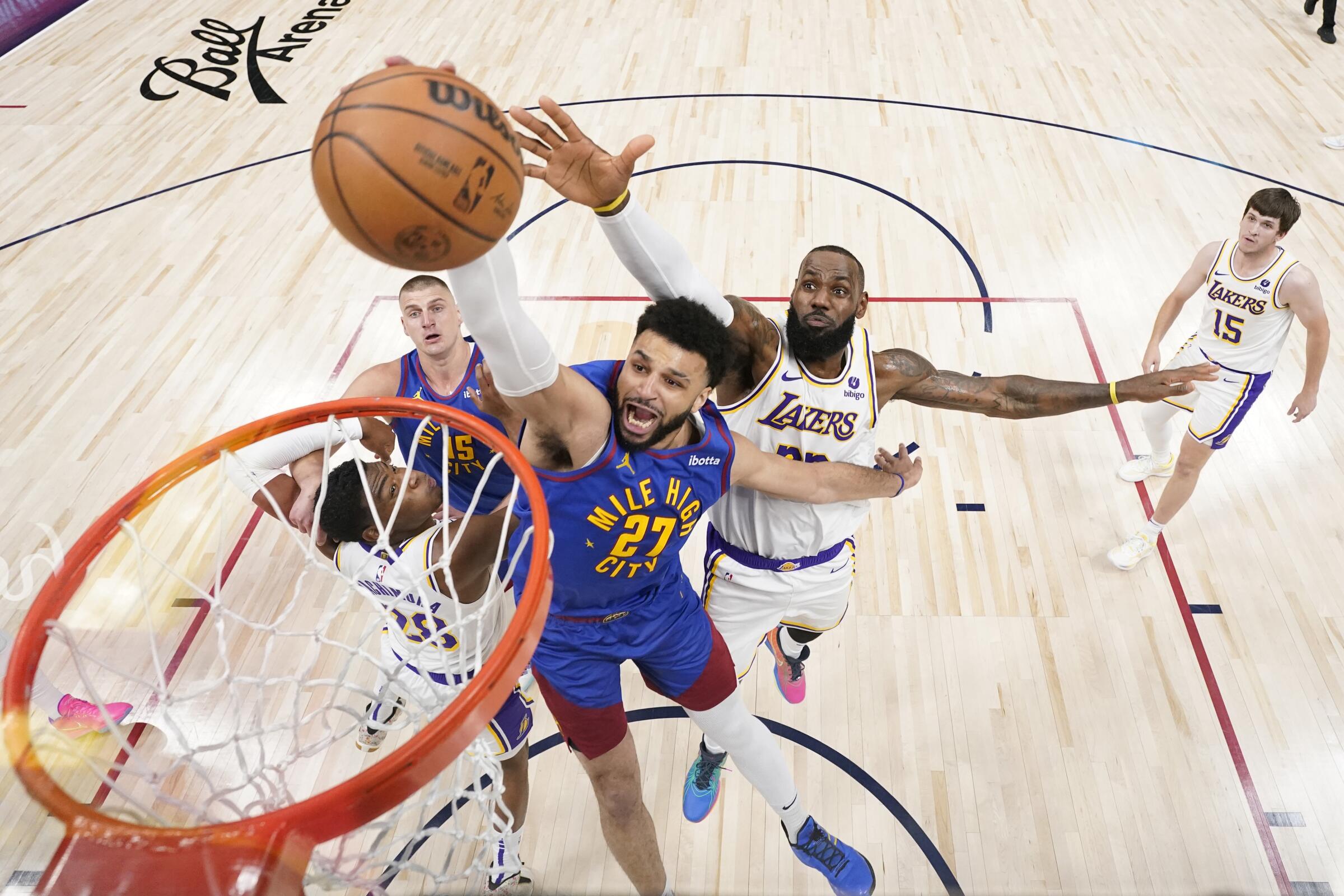 Nuggets guard Jamal Murray elevates for a layup ahead of Lakers forward LeBron James during Game 1 on Saturday.