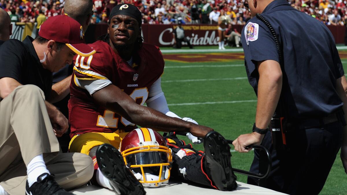 Washington Redskins quarterback Robert Griffin III is carted off the field after suffering an ankle injury against the Jacksonville Jaguars on Sunday.