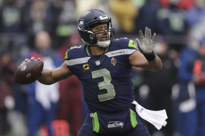 FILE -Seattle Seahawks quarterback Russell Wilson passes against the Detroit Lions during the first half of an NFL football game, Sunday, Jan. 2, 2022, in Seattle. The Seattle Seahawks have agreed to trade nine-time Pro Bowl quarterback Russell Wilson to the Denver Broncos for a massive haul of draft picks and players, two people familiar with the negotiations confirmed to The Associated Press on Tuesday, March 8, 2022. The people spoke on condition of anonymity because the blockbuster trade, which is pending Wilson passing a physical, can't become official until the start of the new league year on March 16. (AP Photo/John Froschauer, File)
