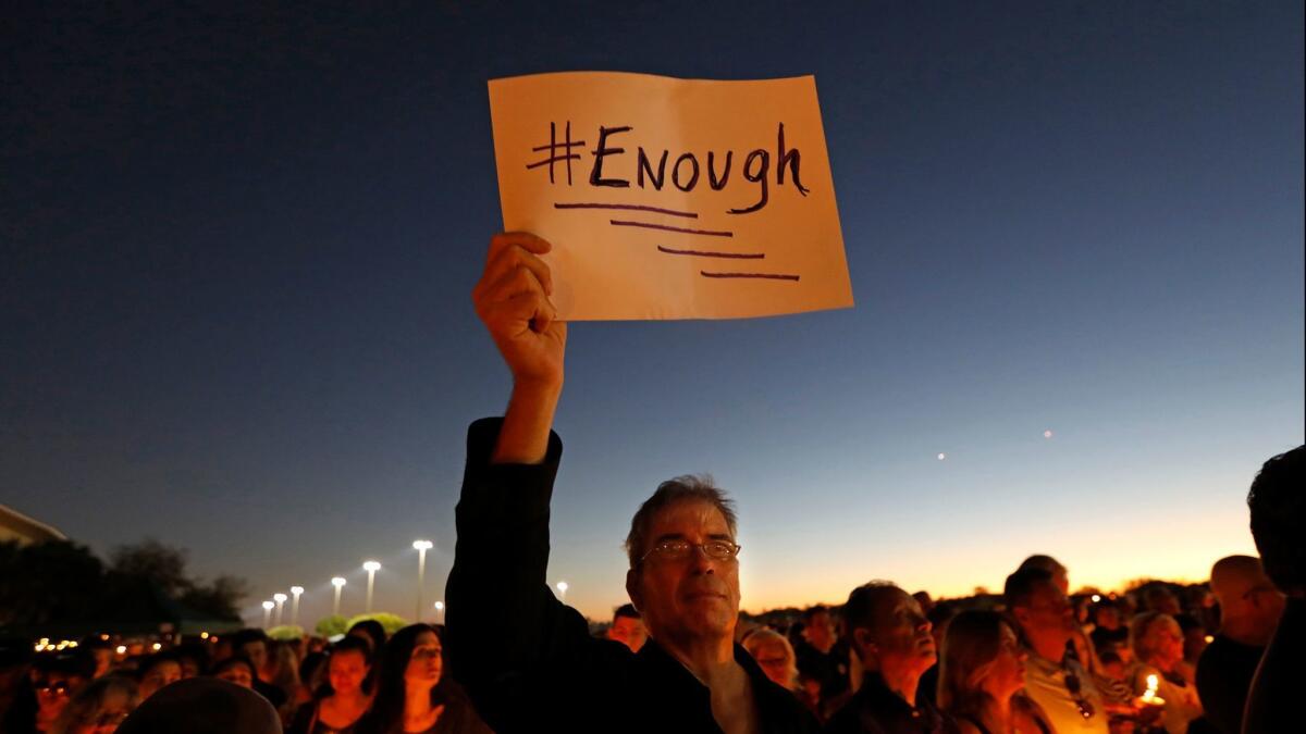 Thousands gathered for an evening vigil at Pine Trails Park in Parkland, Fla., to remember those where were killed and injured in the Marjory Stoneman Douglas High School shooting.