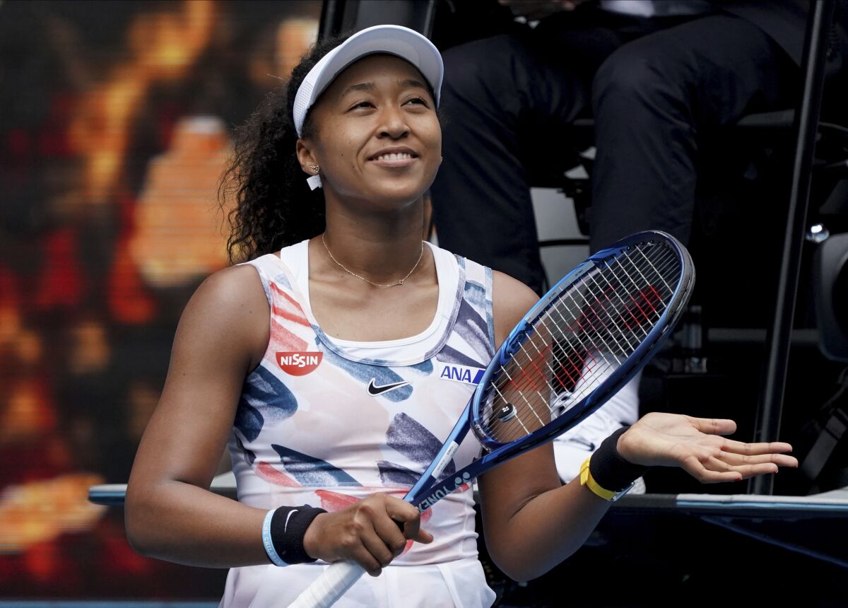 Naomi Osaka celebrates after defeating Marie Bouzkova in a first round singles match Jan. 20 at the Australian Open.