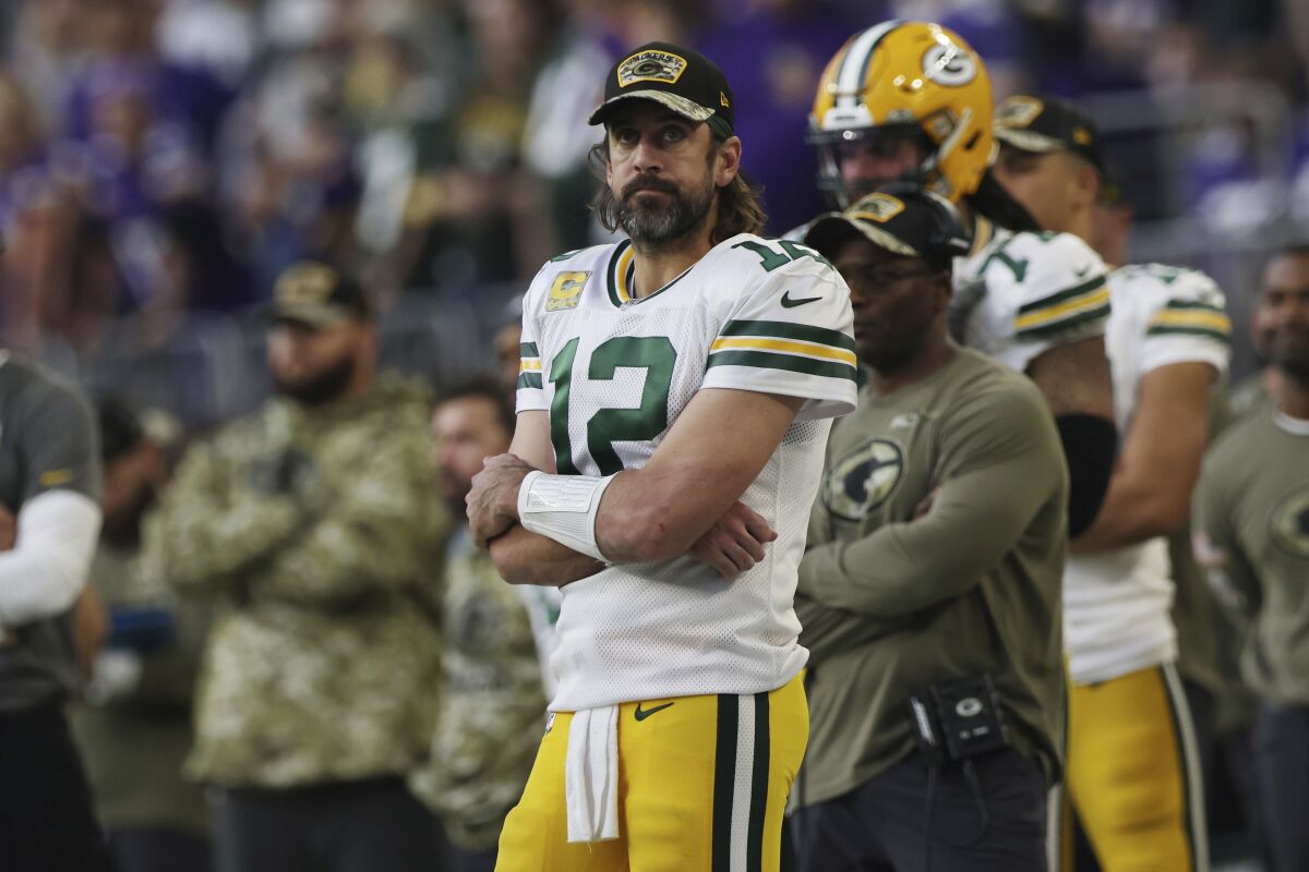 Green Bay Packers quarterback Aaron Rodgers stands on the sideline.