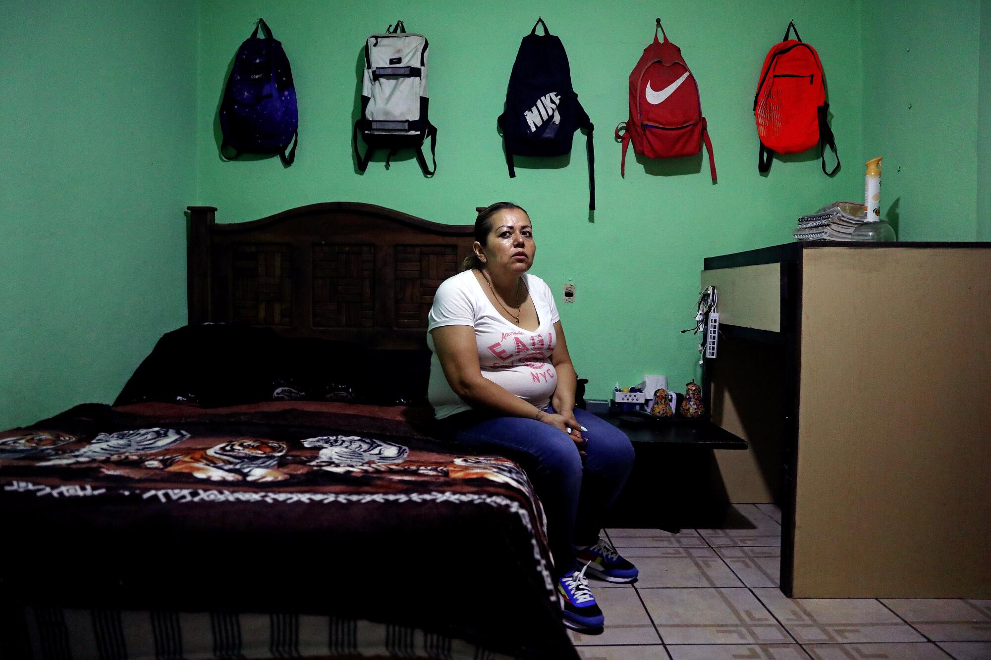 Josefina Rodriguez sits in the room of her 17-year-old son Chino.