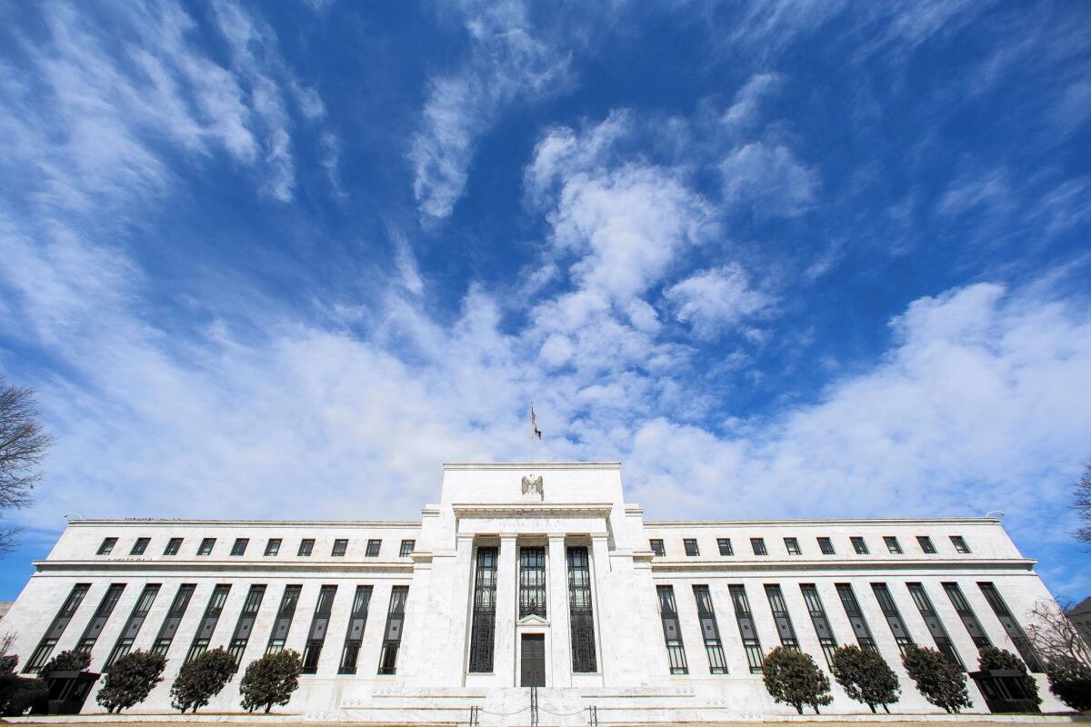 Minutes of Federal Reserve policymakers' discussions showed that officials expressed rising worries about lackluster growth in Europe and slowing growth in Japan and China. Above, the Fed's headquarters in Washington, D.C.