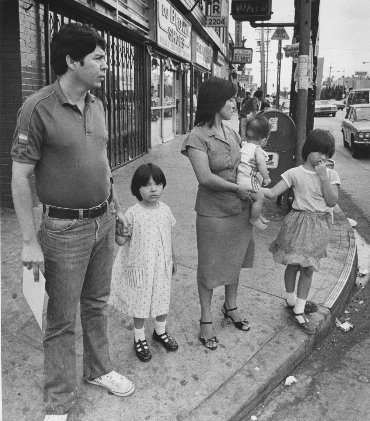 Joaquin and Mercedes Romero and their three children. They are refugees from El Salvador.