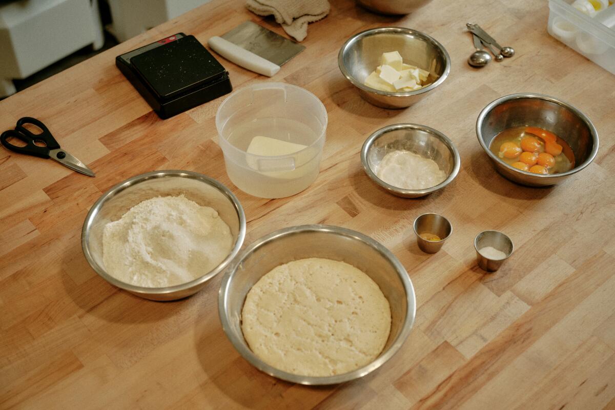 The ingredients for pan de muerto set out in bowls at Gusto Bread in Long Beach