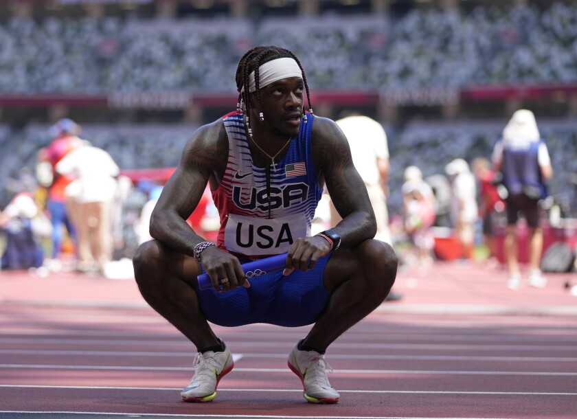 Cravon Gillespie, of United States reacts after finishing a semifinal of the men's 4 x 100-meter relay at the 2020 Summer Olympics, Thursday, Aug. 5, 2021, in Tokyo, Japan. (AP Photo/Francisco Seco)