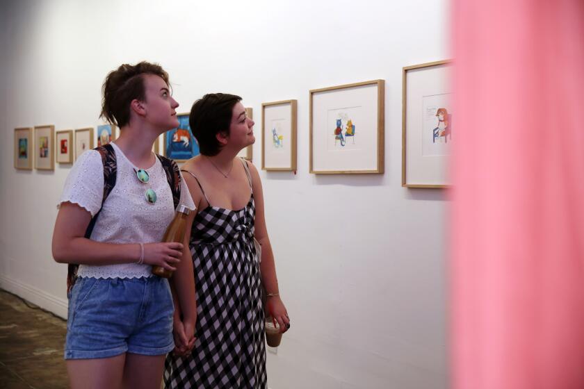 LOS ANGELES, CA-AUGUST 3, 2019: Rylee DeJong, left, and Nicole Kaneski, right, look at art at Jr. High, an art gallery on Hollywood in Thai Town on August 3, 2019 in Los Angeles, California. (Photo By Dania Maxwell / Los Angeles Times)
