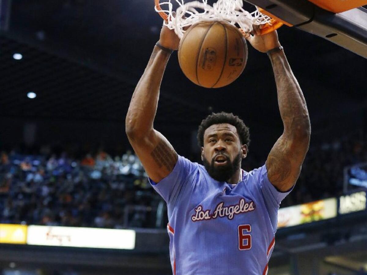 Clippers center DeAndre Jordan dunks in the first half against the Suns.