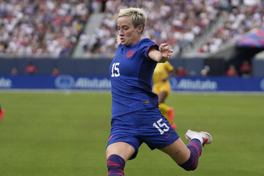 United States forward Megan Rapinoe passes the ball but a goal is declared offsides.
