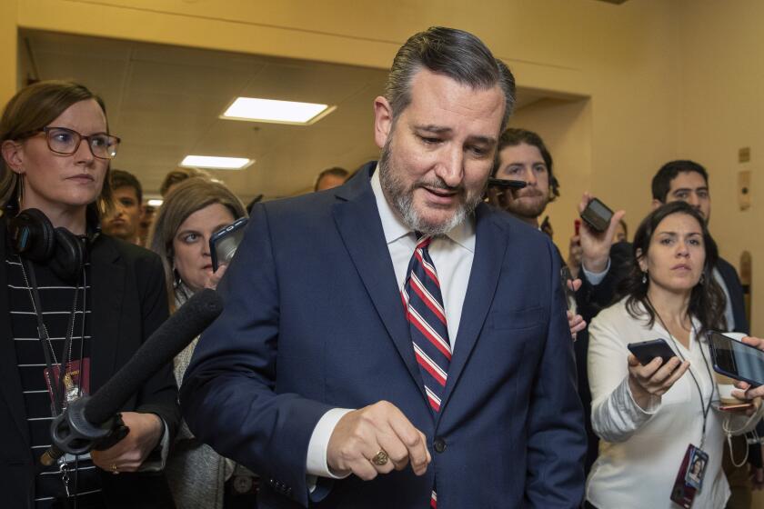 Sen. Ted Cruz, R-Texas, speaks to reporters as he arrives at the Capitol in Washington, Monday, Jan. 27, 2020, during the impeachment trial of President Donald Trump on charges of abuse of power and obstruction of Congress. (AP Photo/Manuel Balce Ceneta)