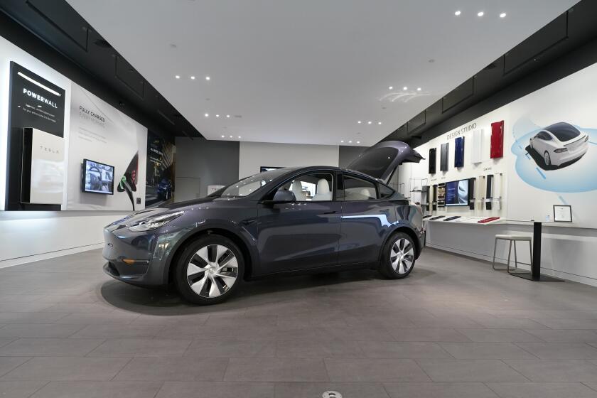 FILE - A Tesla Model Y Long Range is displayed on Feb. 24, 2021, at the Tesla Gallery in Troy, Mich. U.S. auto safety regulators have opened an investigation into Tesla’s Model Y SUV after getting two complaints that the steering wheels can come off while being driven. The National Highway Traffic Safety Administration says the probe covers an estimated 120,000 vehicles from the 2023 model year. (AP Photo/Carlos Osorio, File)