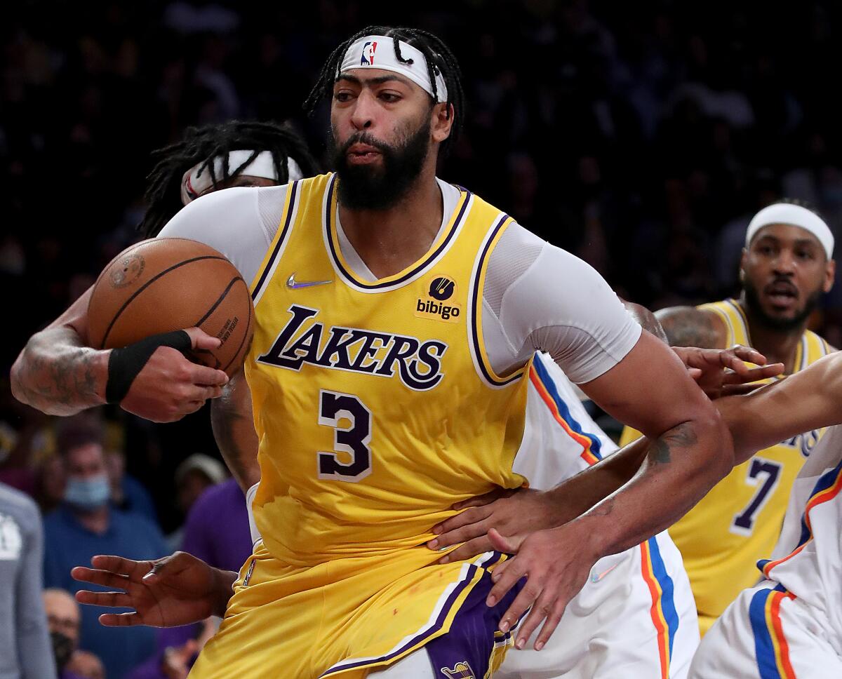 Lakers big man Anthony Davis pulls down a defensive rebound 