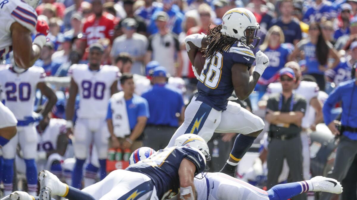 Chargers running back Melvin Gordon III sprints past Bills defenders for a first quarter touchdown.
