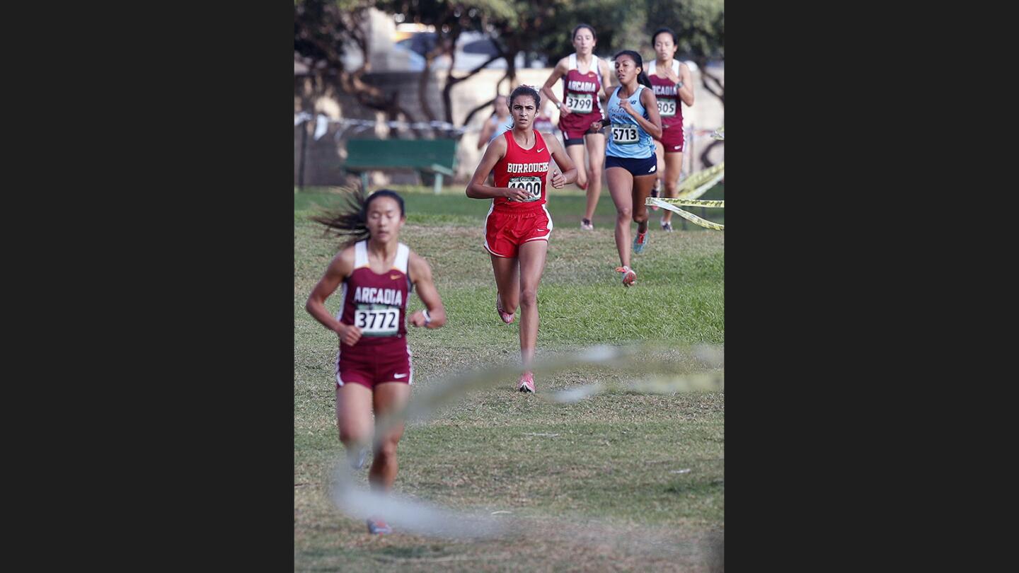 Arcadia's Jasmine He leads at about mile two with Burroughs Emily Virtue running in second in the Pacific League varsity girls' cross country championship at County Park in Arcadia on Wednesday, November 1, 2017.