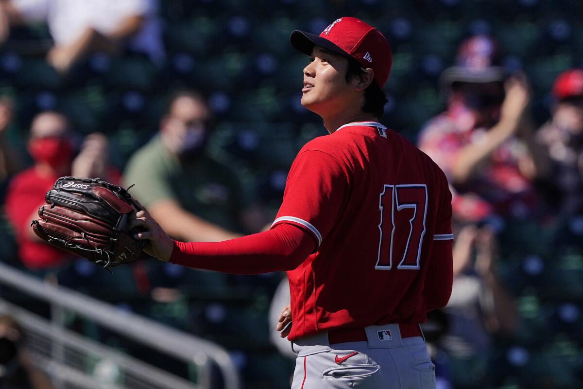 The Angels' Shohei Ohtani acknowledges the crowd after being pulled from a game against the Oakland Athletics.