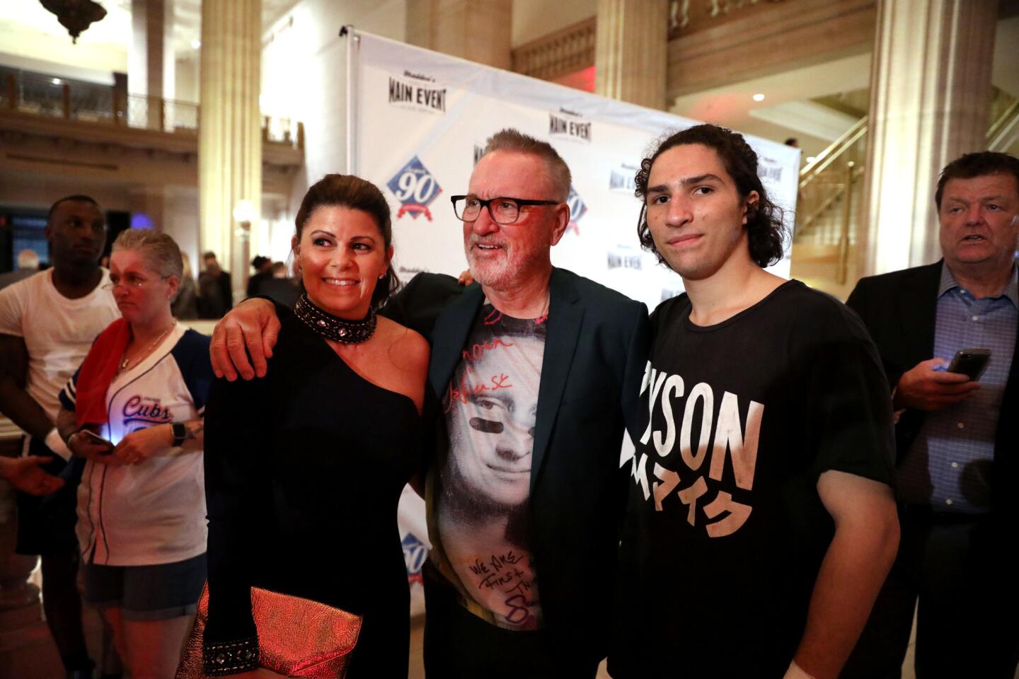 Cubs manager Joe Maddon and his wife, Jaye, pose with boxer Nico Walsh, the grandson of Muhammad Ali, during Maddon's annual charity boxing event called Respect 90 Main Event at the Wintrust Building in downtown Chicago on Friday, May 25, 2018.