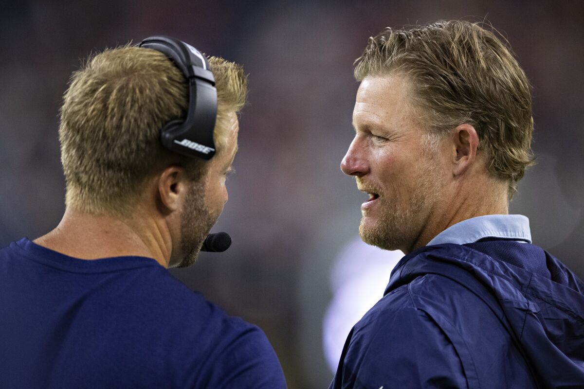 Rams coach Sean McVay talks with general manager Les Snead.