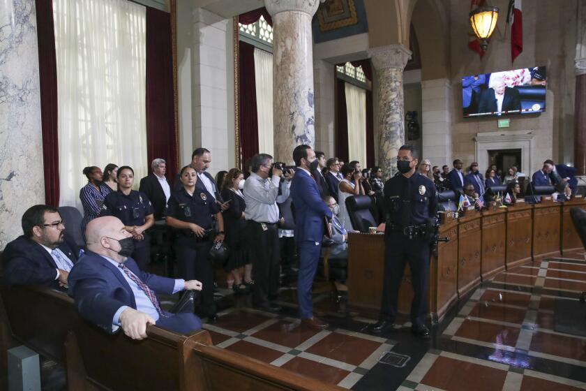 Los Angeles, CA - October 11: People listen to Councilman Mike Bonin address general public at city council meeting. City Hall on Tuesday, Oct. 11, 2022 in Los Angeles, CA. (Irfan Khan / Los Angeles Times)