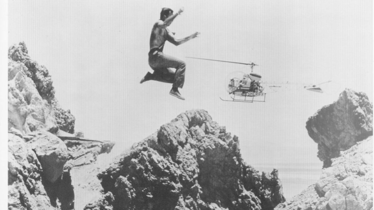 Loren Janes leaps during a scene from the television show "The FBI." (Courtesy of Loren James)