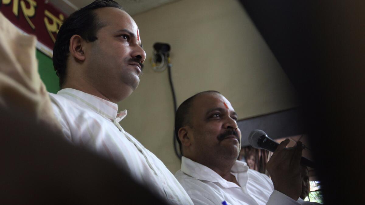Sanatan Sanstha spokesperson Abhay Vartak and Hindu Vidhidnya Parisad secretary Sanjeev Punalekar addressing a press conference in 2013 in Mumbai, India.