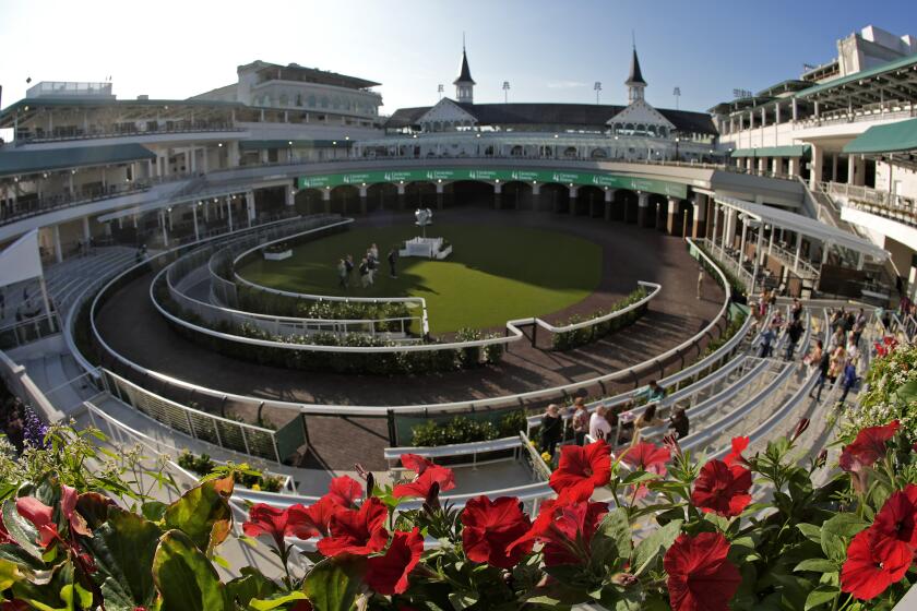 Visitors check out the new $200 million paddock at Churchill Downs Wednesday, May 1, 2024, in Louisville, Ky. The 150th running of the Kentucky Derby is scheduled for Saturday, May 4. (AP Photo/Charlie Riedel)