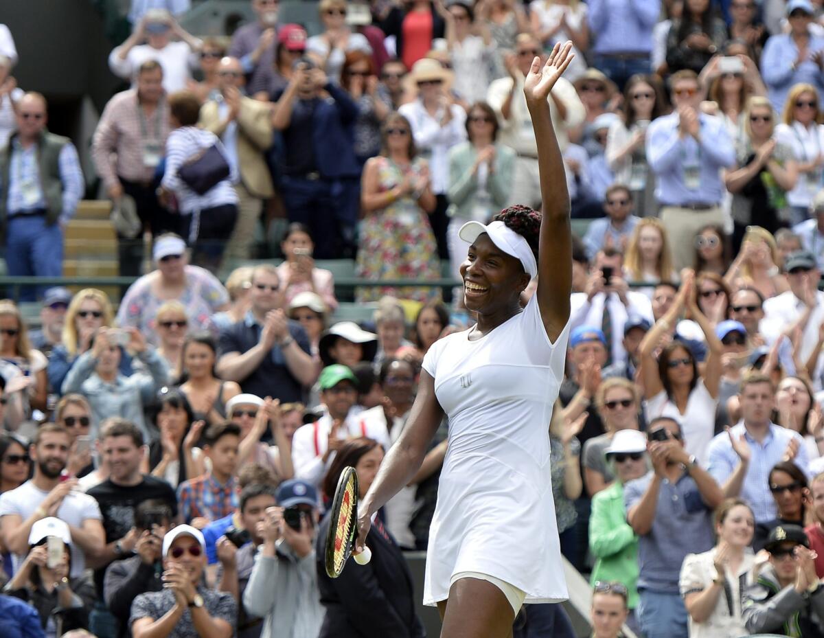 Venus Williams smiles after advancing to the semifinals at Wimbledon.