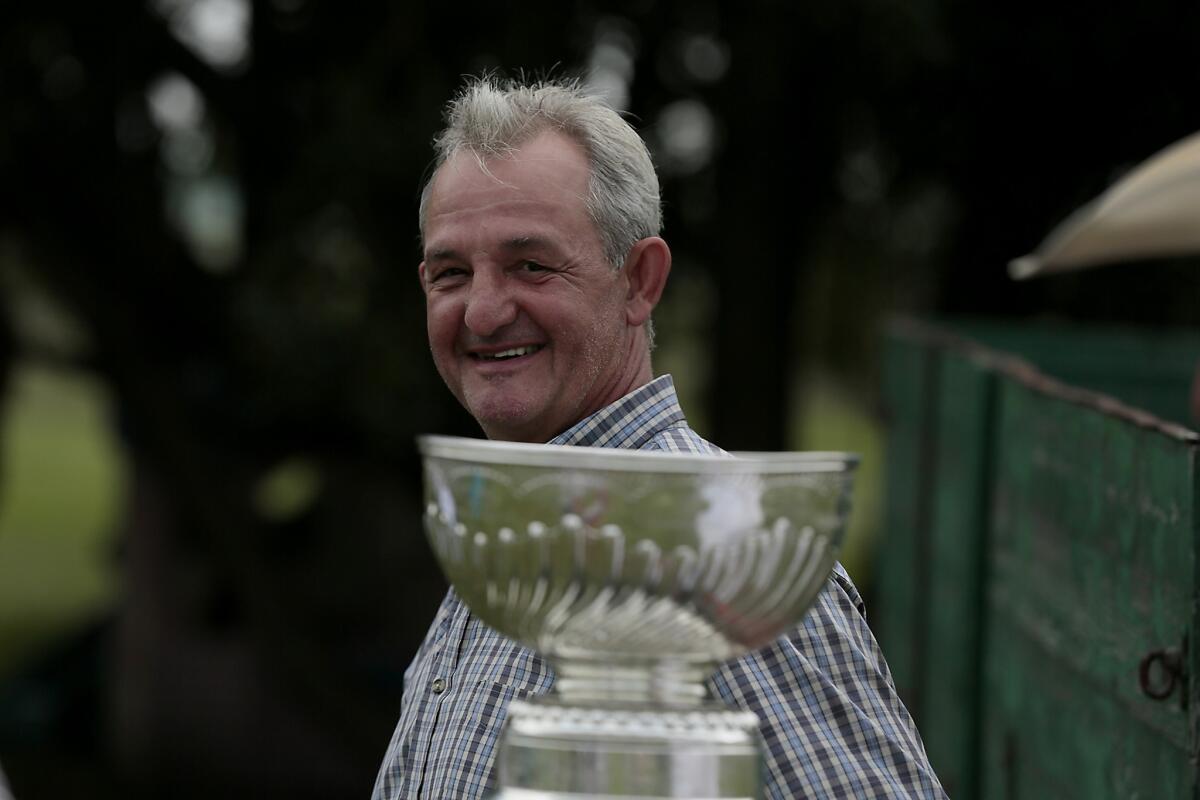 Kings Coach Darryl Sutter smiles at his Viking, Alberta ranch where neighbors and family gathered for a party with the Stanley Cup.