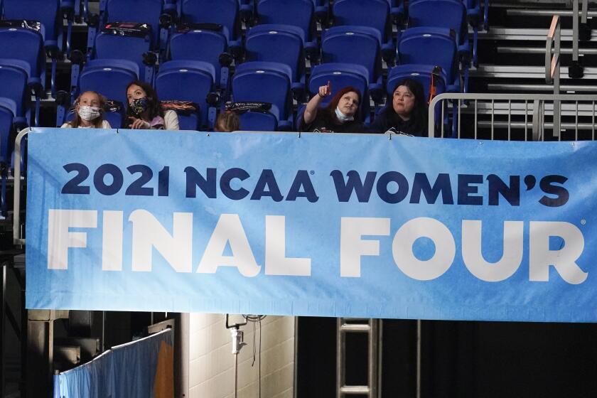 FILE - Fans watch from the stands during the championship game between Stanford and Arizona in the women's Final Four