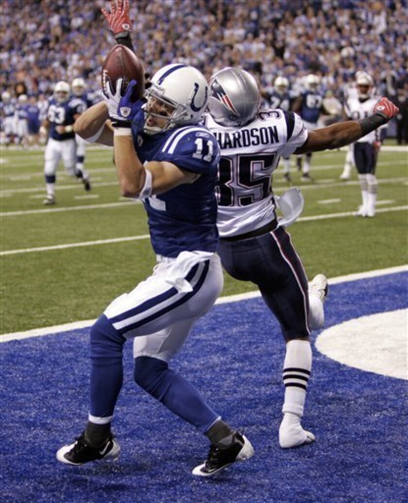 Indianapolis Colts wide receiver Anthony Gonzalez, left, makes a touchdown catch over New England Patriots defensive back Mike Richardson in the third quarter of an NFL football game in Indianapolis, Sunday, Nov. 2, 2008. (AP Photo/Michael Conroy)