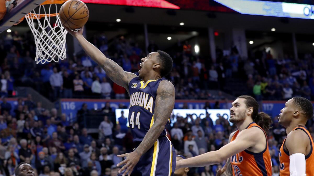 Pacers guard Jeff Teague scores two of his 30 points against the Thunder on Sunday.