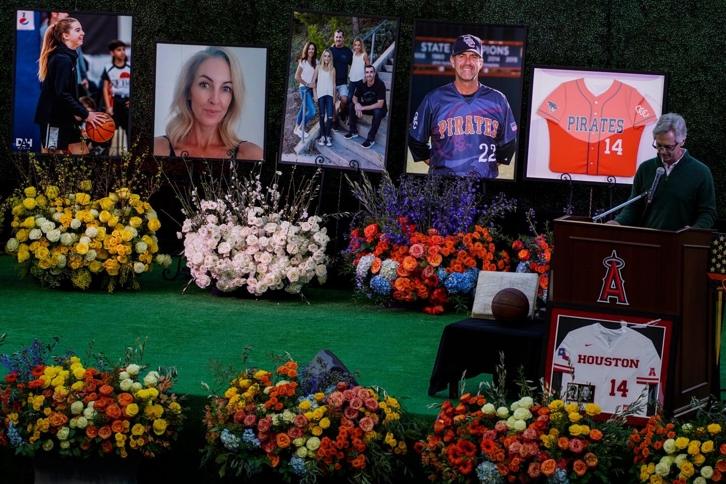 Clarke Smith, a longtime friend of John Altobelli, speaks during a celebration of life ceremony at Angel Stadium on Monday in Anaheim to honor the lives of John, Keri and Alyssa Altobelli.