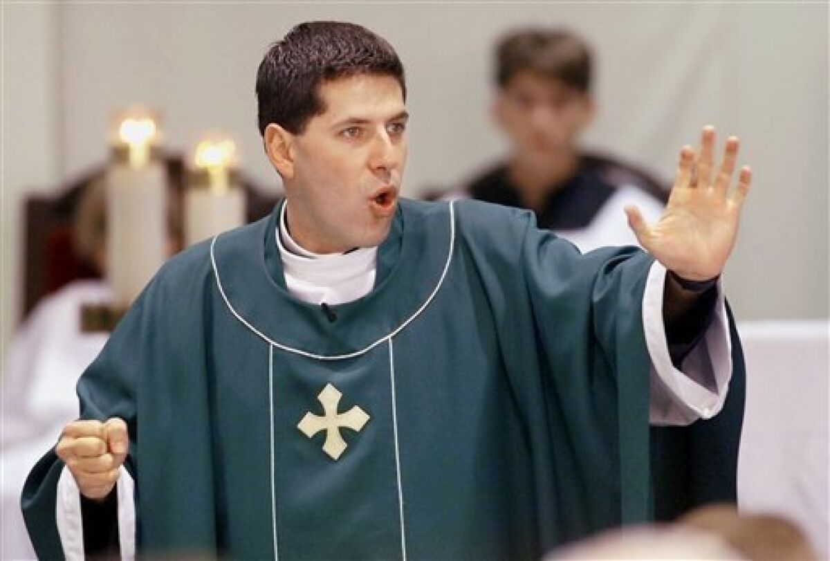 FILE - In this Sunday, Oct. 3, 1999 file photo, Father Alberto Cutie speaks to his congregation during service, at St. Patrick's Church in Miami Beach, Fla. (AP Photo/Tony Gutierrez, file)