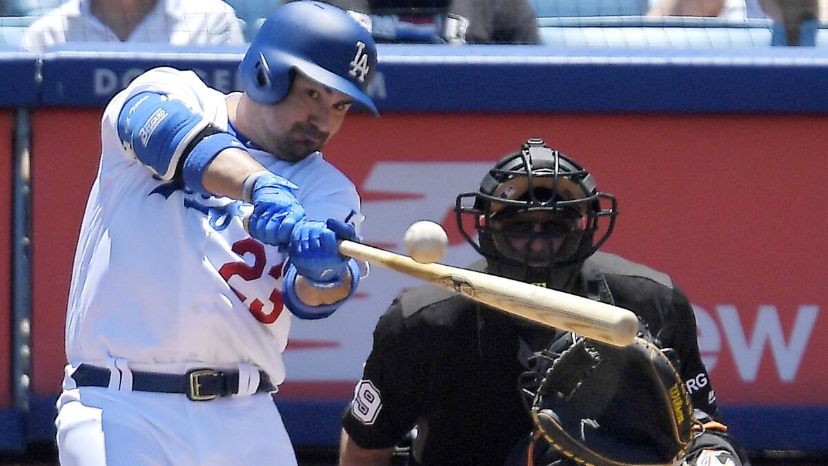 Adrian Gonzalez hits two RBI double against the Miami Marlins during the first inning on May 21.